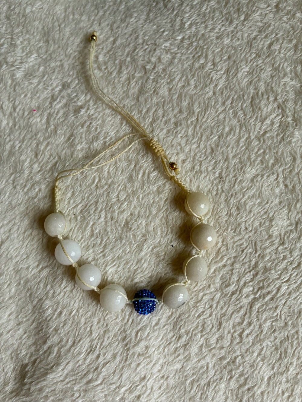 Adjustable White Bead Bracelet with Blue Accent